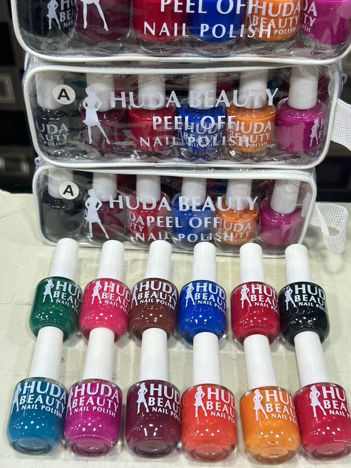 Huda Beauty Peel Off Nail Paint Variety Pack™ – 12 Trendy Hues